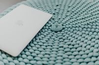 Kaboompics - MacBook Laptop on a blue pouf