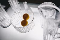 Kaboompics - Overhead Crystal Glassware Display with Citrus