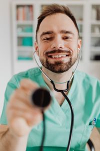 Kaboompics - Doctor Presenting Stethoscope in Office Portrait