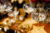 Kaboompics - Single Champagne Flute and Gold Star Ornament in Soft-Focus New Year's Eve Scene