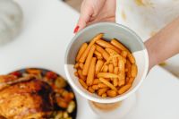Kaboompics - Thanksgiving Carrots Served beside a Roast Turkey Platter