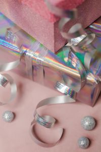 Kaboompics - Silver Curling Ribbon on Holographic Gift Wrap