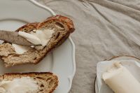 Kaboompics - Close-Up of Butter on Rustic Bread