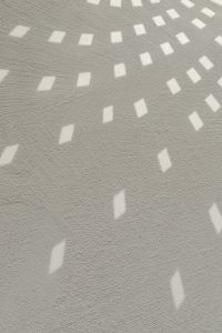 Kaboompics - Textured White Wall with Geometric Light Reflections