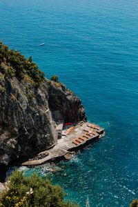 Kaboompics - Lone Boat on Open Blue Water beside Amalfi Coast Cliffs