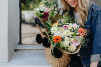 Kaboompics - Woman with Wicker Flower Basket Sitting by a Window
