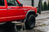 Kaboompics - Red Jeep Cherokee Side Profile with Front Tire in Rain