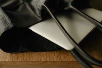 Kaboompics - Close-Up of Laptop Edge and Leather Bag Strap
