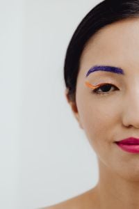Kaboompics - Minimal Asian Beauty Portrait with Purple Eyebrow, Orange Eyeliner and Pink Lipstick