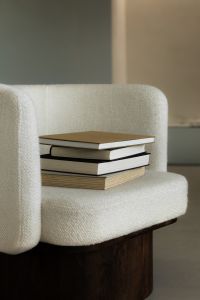 Kaboompics - Minimalist Home Interior with Stack of Books on Lounge Chair