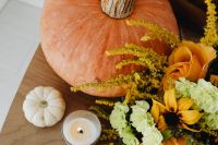 Kaboompics - Close Up of Pumpkin Candle and Autumn Flowers