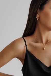 Kaboompics - Black Satin Camisole with Gold Necklace and Hoop Earring