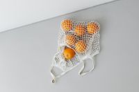 Kaboompics - Wide Zero-Waste Citrus Still Life with Copy Space and Cotton Mesh Bag