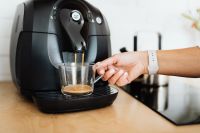 Kaboompics - Fresh Espresso Pouring into a Glass Cup for a Bright Kitchen Coffee Routine