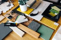 Kaboompics - Designers working with material samples and paper cutouts