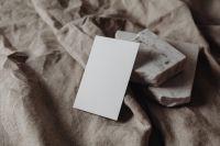Kaboompics - Neutral Business Card Mockup with Stacked Marble and Draped Linen