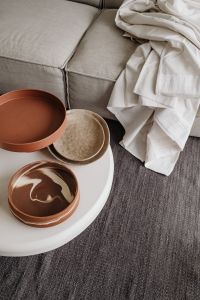 Kaboompics - Ceramic Bowls on Round White Coffee Table with Linen – Fujifilm X100VI