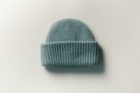 Kaboompics - Light Blue Knit Beanie Flat Lay for Winter Accessories