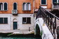 Kaboompics - Green Iron Footbridge beside a Terracotta Canal-Side Palazzo in Murano, Venice