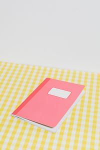 Kaboompics - Minimal Pink School Notebook on Yellow Gingham