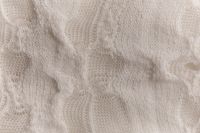Kaboompics - Cream Knitted Textile With Dimensional Surface