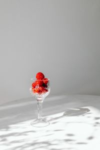 Kaboompics - Raspberry Filled Stemmed Glass In Sunlight