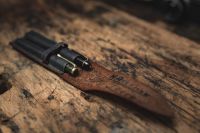 Kaboompics - Fountain Pens and Leather Case on a Rustic Wooden Desk