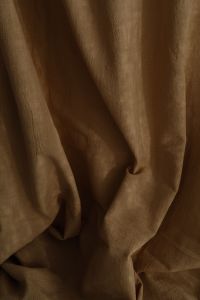 Kaboompics - Close-Up of Brown Curtain Gathered into Sculptural Draped Folds