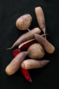 Kaboompics - Purple and Red Root Vegetables on a Black Background