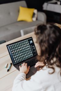 Kaboompics - Overhead View of Woman Using Laptop with Text on Screen