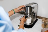Kaboompics - Close-Up Flash Photography of Hands Using Espresso Machine