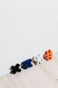 Kaboompics - Colorful Plus, Pi, Percent and Multiplication Symbols on Pale Stone for Math Learning Materials