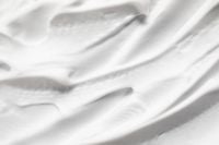Kaboompics - Wide Close-Up of Layered White Cream Ridges with Soft Gray Shadows