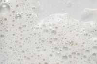 Kaboompics - White Facial Cleanser Foam with Clear Bubbles, Bright Skincare Macro Background