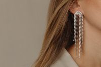 Kaboompics - Long Crystal Earring on Woman's Ear