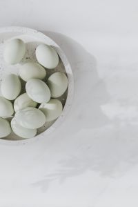 Kaboompics - Easter flat lay with green eggs on a white marble