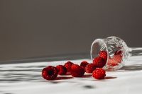Kaboompics - Raspberries Spilling From A Tipped Glass
