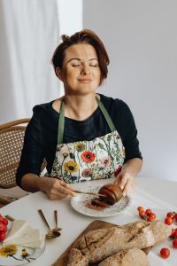 Kaboompics - Woman Preparing Fresh Produce in a Floral Apron