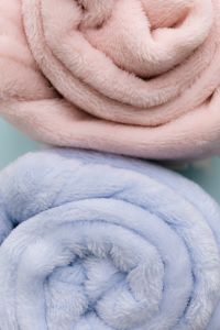 Kaboompics - Rolled Pastel Blankets Texture In Pink And Blue Colors