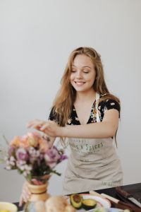 Kaboompics - Soft Focus Flower Bouquet with Smiling Woman in Apron