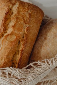 Kaboompics - Vertical Close-Up of Ciabatta Loaves in a Mesh Bag