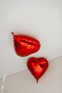 Kaboompics - Red Heart Foil Balloons Near a White Ceiling