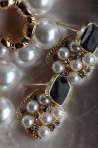 Kaboompics - Layered Pearl and Black Gemstone Earrings with Gold Settings, Macro