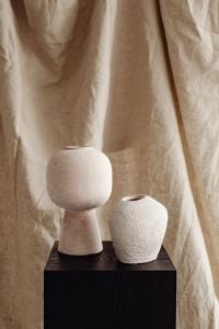 Kaboompics - Minimalist Ceramic Vases on a Dark Plinth with Linen Draped Background