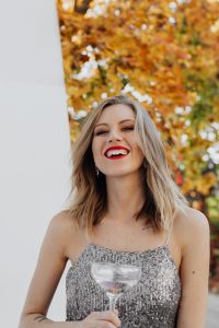 Kaboompics - Laughing Close-Up Portrait with Champagne in Silver Sequin Dress