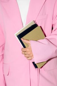 Kaboompics - Person in Pink Suit Holding Books