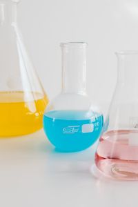 Kaboompics - Laboratory Glassware With Blue and Yellow Liquid