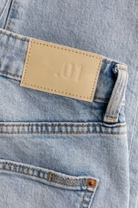 Light Blue Denim Jeans Details, Stitching and Fabric Textures for Fashion Backgrounds
