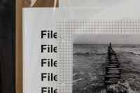 Kaboompics - Black and White Ocean Photo Layered with Grid Paper and Files Typography