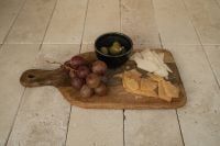 Kaboompics - Cheese Board with Grapes and Olives on Stone Floor